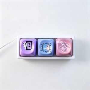 Three cute chibi character keycaps